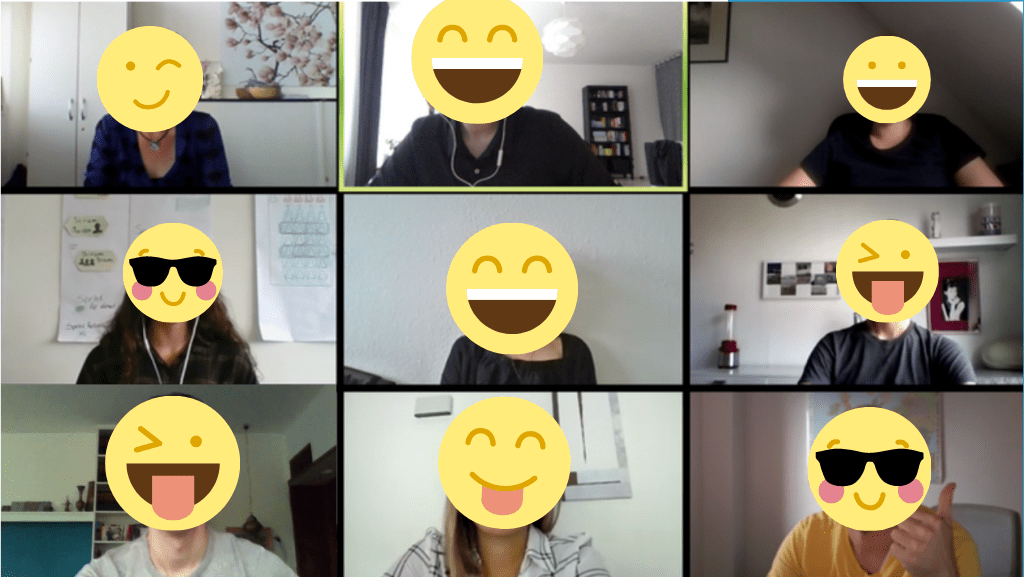 Online Meeting aus dem Home Office. Über die Gesichter der Kolleg*innen sind Emojis gelegt.
